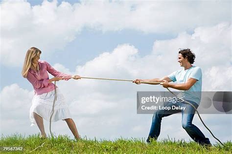 Two Girl Pulling The Rope Against Each Other To Win